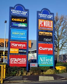 Signs at entrance to County Oak Retail Park, Crawley