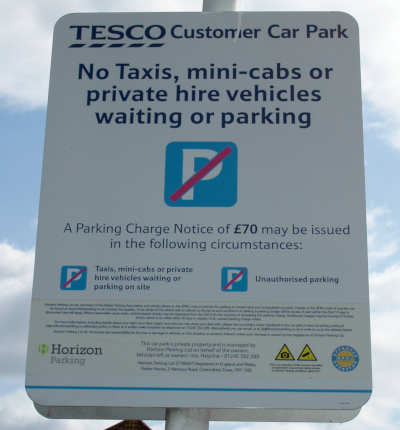 Car parking sign including the words 'Taxis, minicabs or private hire vehicles waiting or parking